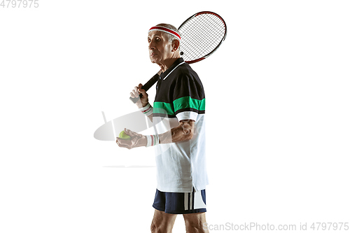 Image of Senior man playing tennis in sportwear isolated on white background