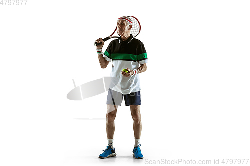 Image of Senior man playing tennis in sportwear isolated on white background