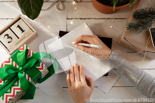 Image of Writes wishes, dreams and goals, making plan for New Year and Christmas