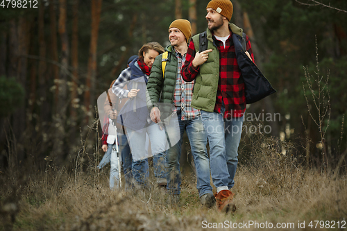 Image of Group of friends on a camping or hiking trip in autumn day