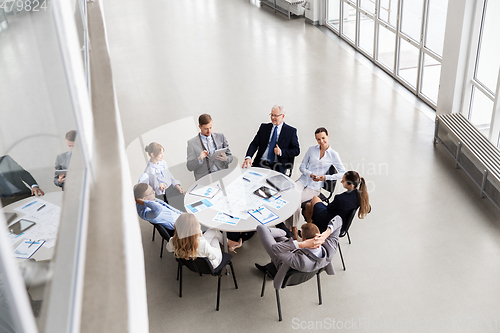 Image of business team with scheme meeting at office