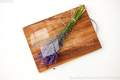 Image of bunch of lavender flowers on wooden board