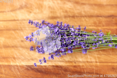 Image of bunch of lavender flowers on wooden board