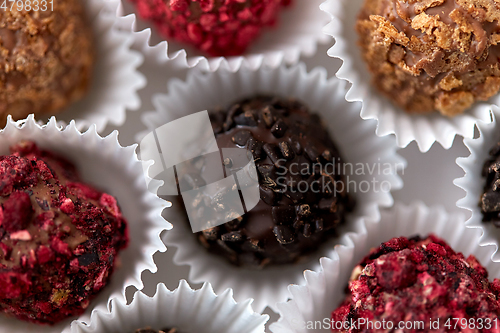 Image of close up of different candies in paper cups