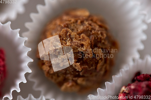 Image of close up of different candies in paper cups