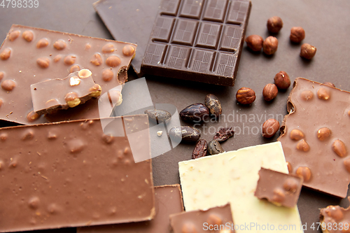 Image of chocolate bars with hazelnuts and cocoa beans