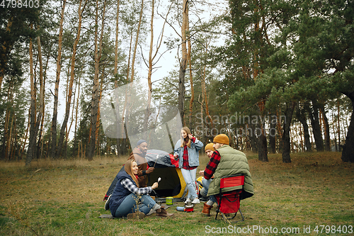 Image of Group of friends on a camping or hiking trip in autumn day