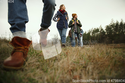 Image of Group of friends on a camping or hiking trip in autumn day