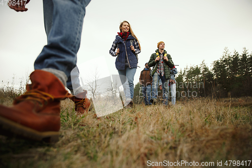 Image of Group of friends on a camping or hiking trip in autumn day