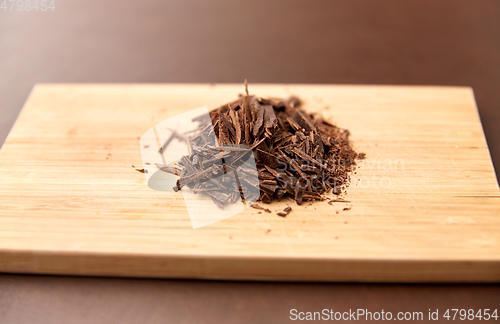 Image of chocolate chips on wooden board