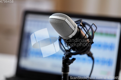 Image of close up of microphone at recording studio