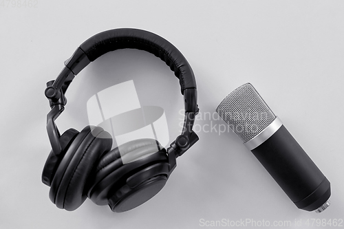 Image of headphones and microphone on white background