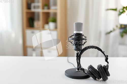 Image of headphones and microphone at home office