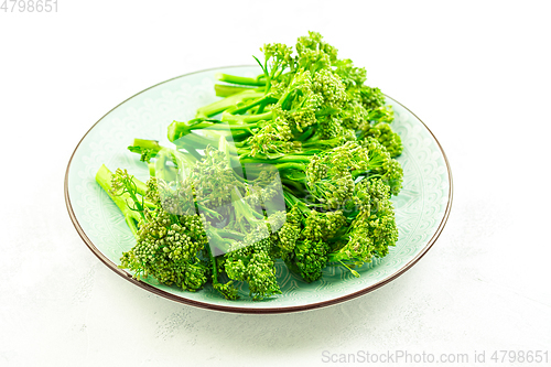 Image of Organic Broccolini (bimi) in bowl on white background