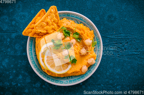 Image of Homemade spicy humus chilli and chickpeas tortilla chips