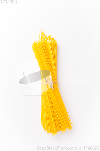 Image of Spaghettini - thinner Spaghetti. Raw Spaghetti on white background 