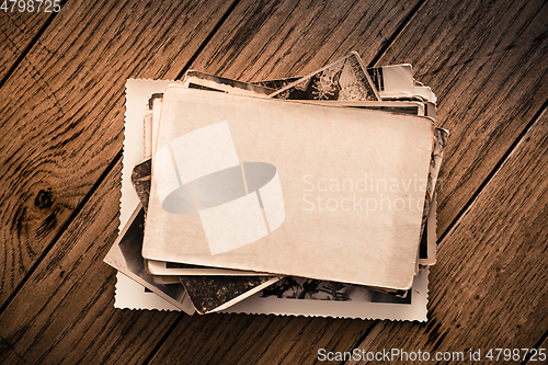 Image of Memories - stock of old and vintage photos on wooden background