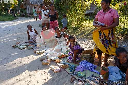 Image of Malagasy woman from village selling souvenir, Madagascar