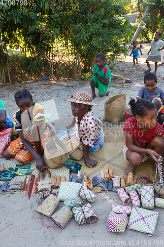 Image of Malagasy woman from village selling souvenir, Madagascar