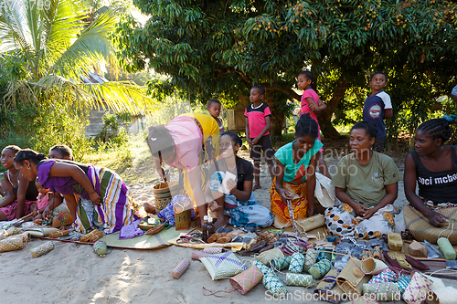 Image of Malagasy woman from village selling souvenir, Madagascar