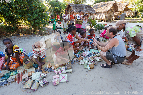 Image of Malagasy woman from village selling souvenir, Madagascar