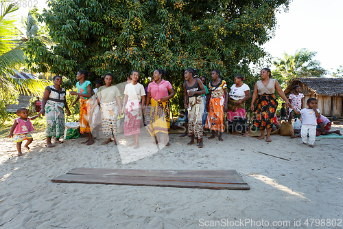 Image of Malagasy woman from village traditional singing and dancing