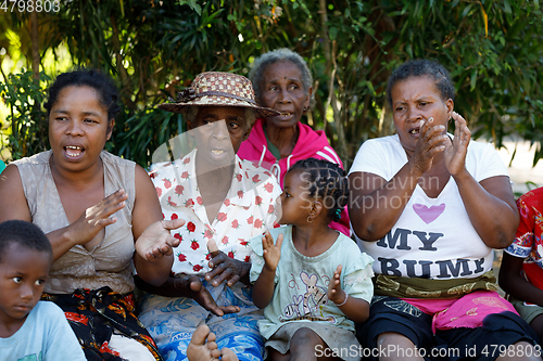 Image of Malagasy woman from village traditional singing and dancing