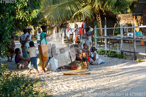 Image of Malagasy woman from village selling souvenir, Madagascar