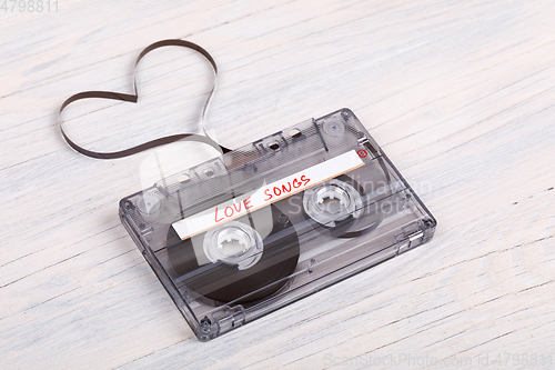 Image of Audio cassette tape on wooden background. audio film shaping hea