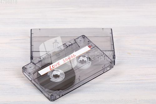 Image of Audio cassette tape on wooden background