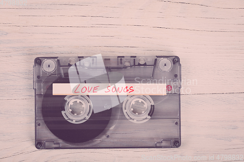 Image of Audio cassette tape on wooden background