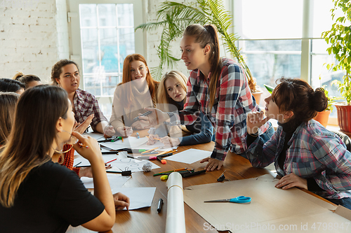 Image of Young people discussing about women rights and equality at the office