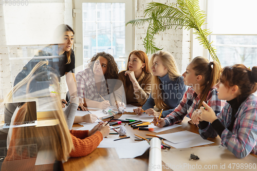 Image of Young people discussing about women rights and equality at the office