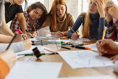 Image of Young people discussing about women rights and equality at the office