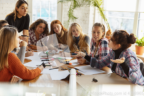 Image of Young people discussing about women rights and equality at the office