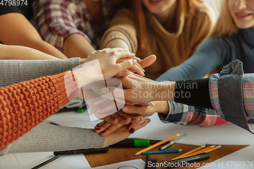 Image of Young people discussing about women rights and equality at the office