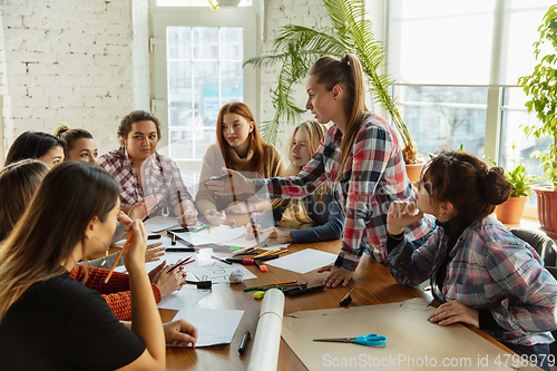 Image of Young people discussing about women rights and equality at the office