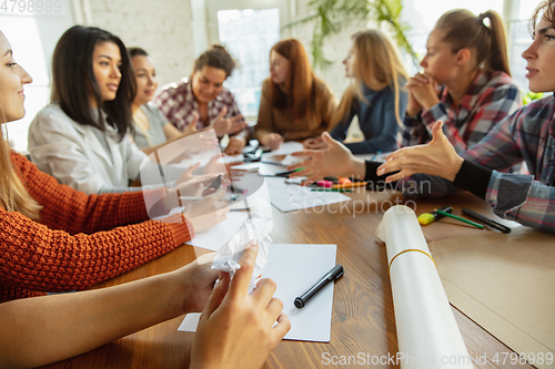 Image of Young people discussing about women rights and equality at the office