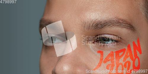 Image of Caucasian young man\'s close up portrait on bright background, Tokyo 2020