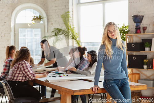 Image of Young people discussing about women rights and equality at the office