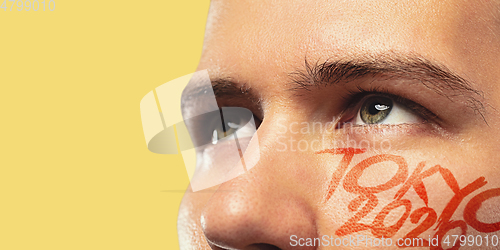 Image of Caucasian young man\'s close up portrait on bright background, Tokyo 2020