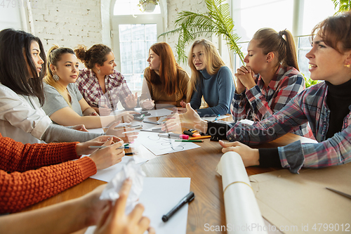 Image of Young people discussing about women rights and equality at the office