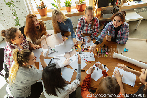 Image of Young people discussing about women rights and equality at the office