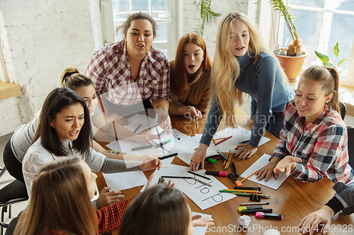 Image of Young people discussing about women rights and equality at the office