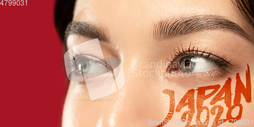 Image of Caucasian young woman\'s close up portrait on bright background, Tokyo 2020