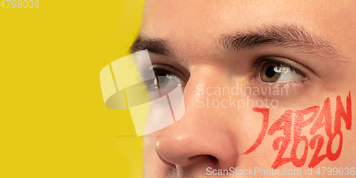 Image of Caucasian young man\'s close up portrait on bright background, Tokyo 2020