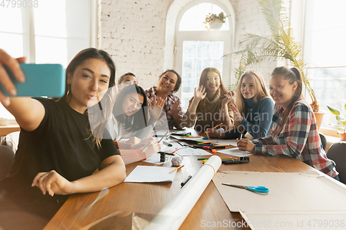 Image of Young people discussing about women rights and equality at the office