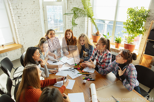 Image of Young people discussing about women rights and equality at the office