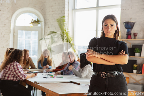 Image of Young people discussing about women rights and equality at the office