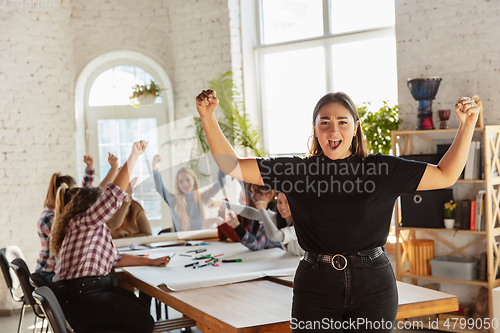 Image of Young people discussing about women rights and equality at the office